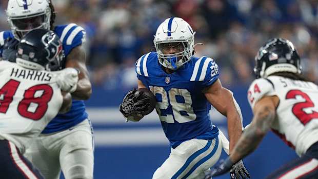 Indianapolis Colts running back Jonathan Taylor (28) runs the ball on Saturday, Jan. 6, 2024, during a game against the Houston Texans at Lucas Oil Stadium in Indianapolis.  